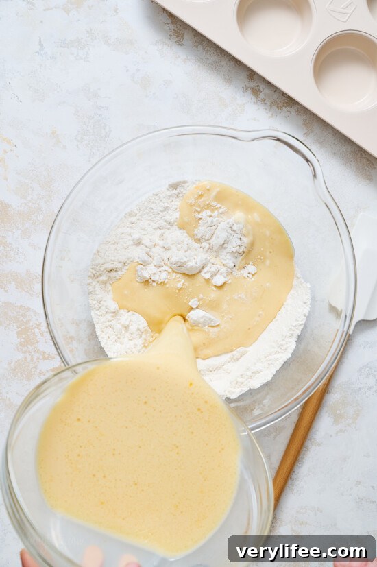 Fluffy Pancake Muffins with Maple Syrup Glaze 7 mixing pancake batter