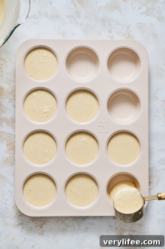 Fluffy Pancake Muffins with Maple Syrup Glaze 9 Pancake Muffin batter in tin