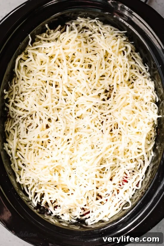 Slow Cooker Lasagna Recipe: Cheesy, Tender Layers 11 Finish with cheese