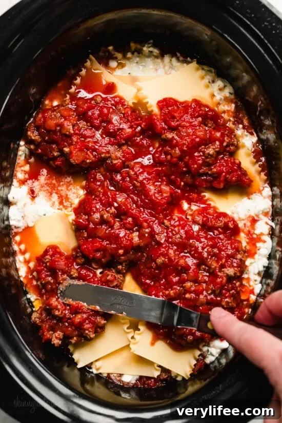 Slow Cooker Lasagna Recipe: Cheesy, Tender Layers 10 Add the sauce