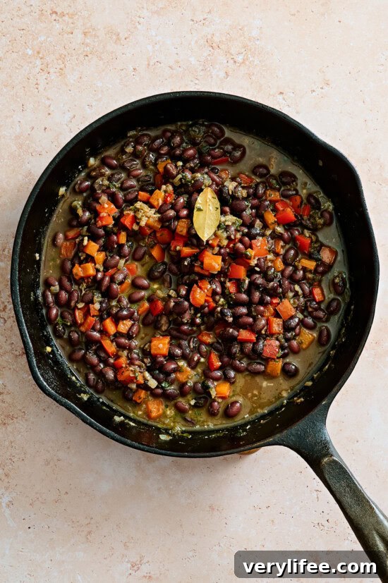 Chicken Taco Bowl Recipe: Flavorful Weeknight Meal 10 Black beans in skillet