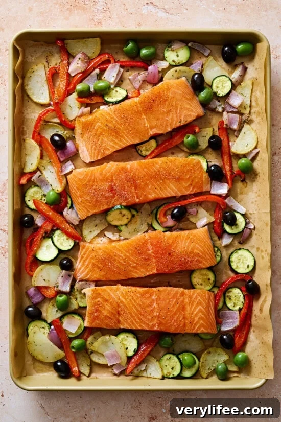 Add the salmon to the sheet pan with the vegetables