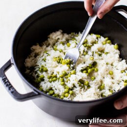 fluffing rice with a fork