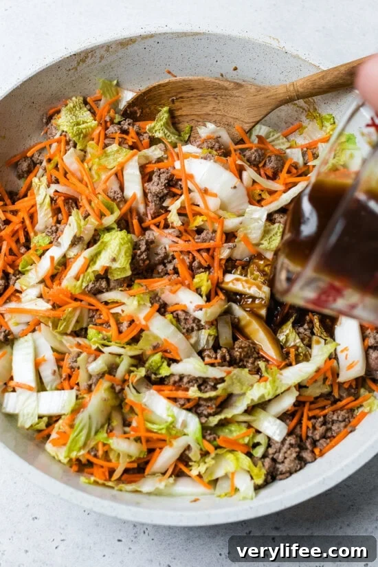 Soy-Garlic Beef and Cabbage Stir-Fry 8 adding stir fry sauce to beef