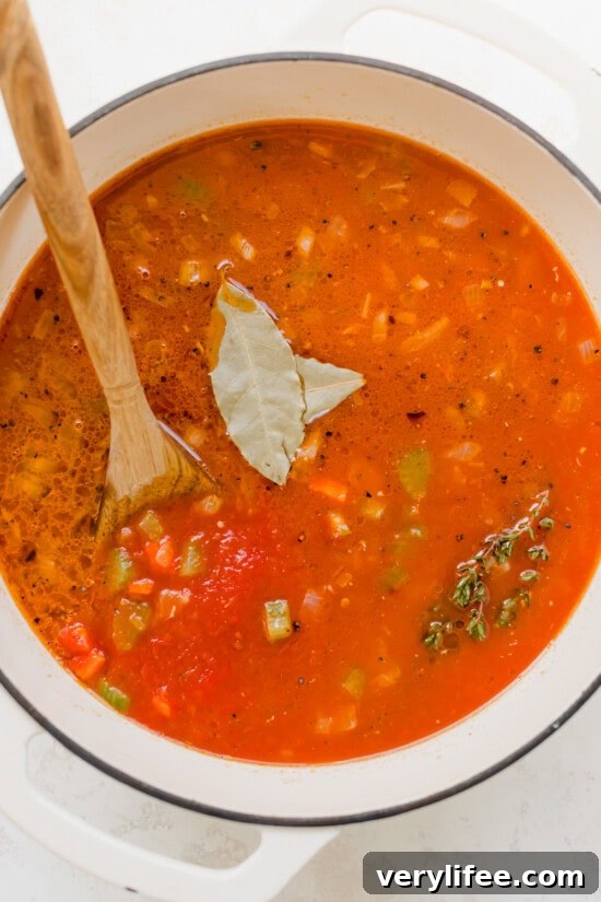 Tomatoes, bay leaves in a pot