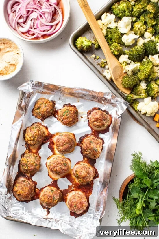 Sheet Pan Mediterranean Meatball Bowls with Hummus 9 juicy turkey meatballs, roasted sweet potatoes, cauliflower and broccoli