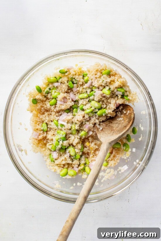 Protein-Packed Vegan Quinoa Bowl with Roasted Veggies and Tahini 7 quinoa and edamame in a bowl