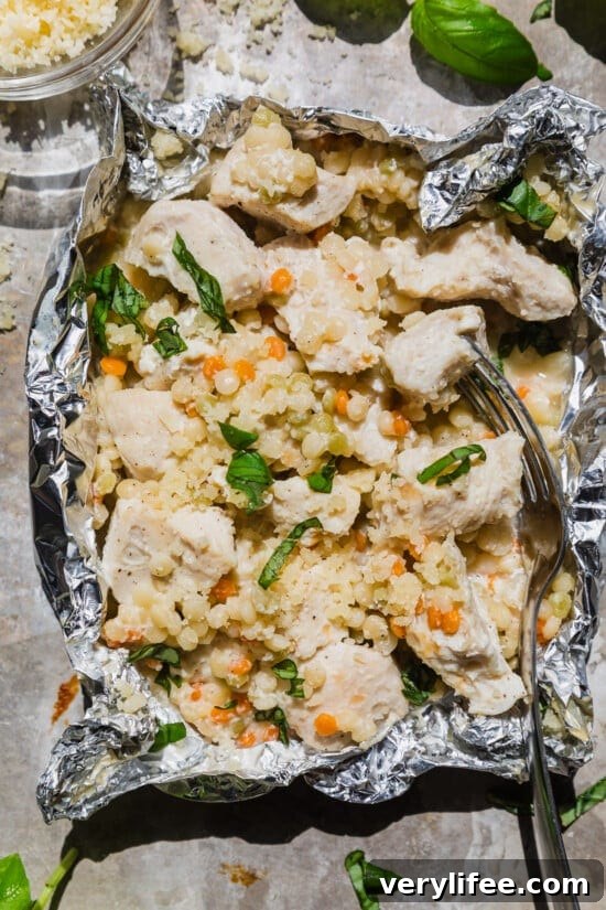 14 Flavor-Packed Foil Packet Recipes for Camping and Grilling 6 Garlic Parmesan Chicken Foil Packets with Couscous