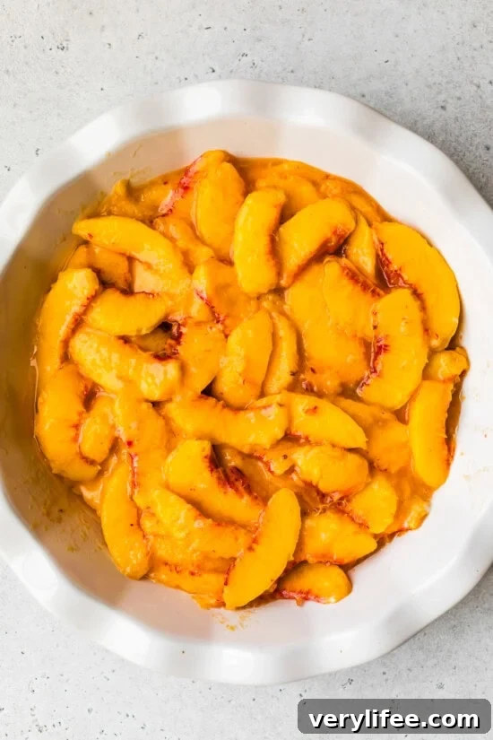 Classic Peach Crisp Recipe with Oat Streusel 6 peaches in a pie dish