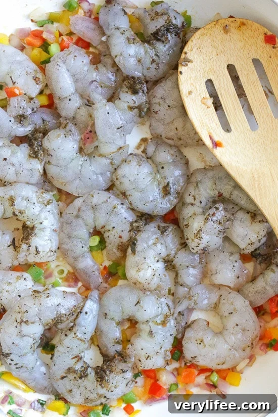 Jamaican Coconut Shrimp Stew Quick Jamaican shrimp recipe. Raw shrimp in a skillet.