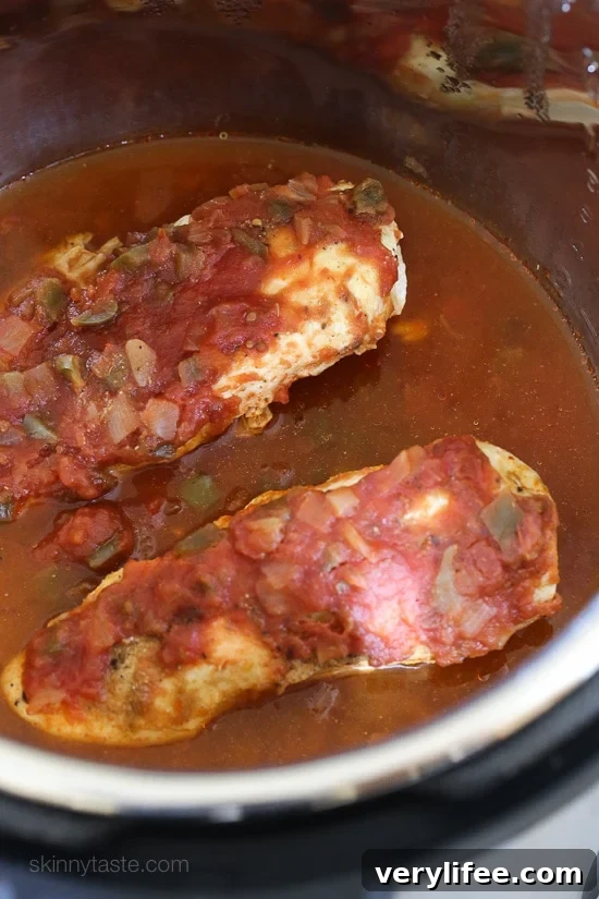 Cooked salsa chicken inside the Instant Pot.