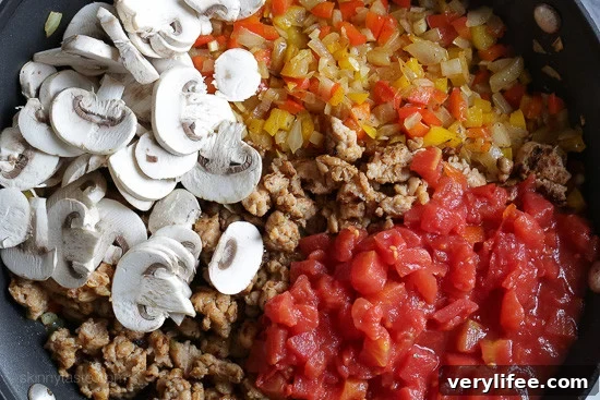 Cheesy Sausage Macaroni Casserole Recipe 5 Chicken sausage, bell peppers, onions and mushrooms simmered in a marinara sauce then baked in the casserole with whole wheat macaroni topped with mozzarella.