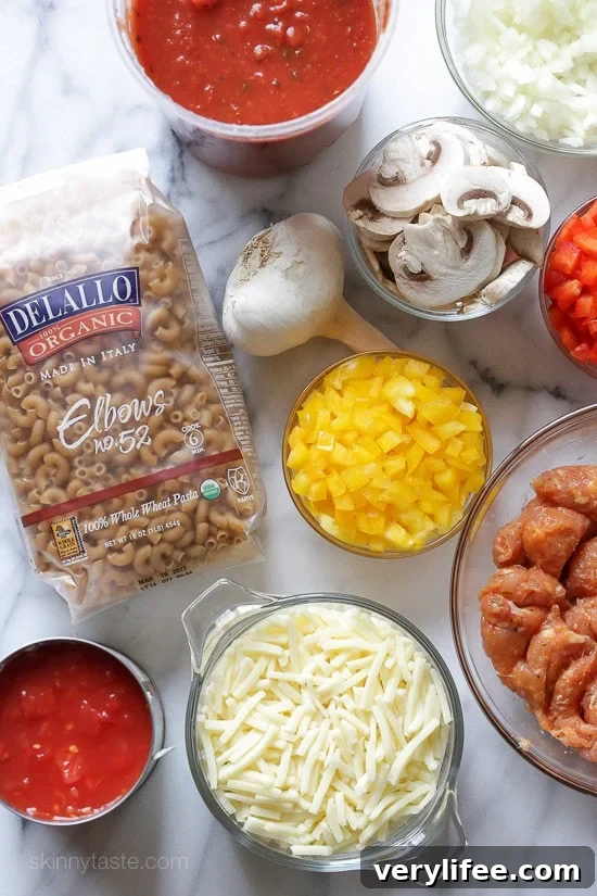 Chicken Sausage and Peppers Macaroni Casserole Chicken sausage, bell peppers, onions and mushrooms simmered in a marinara sauce then baked in the casserole with whole wheat macaroni topped with mozzarella.