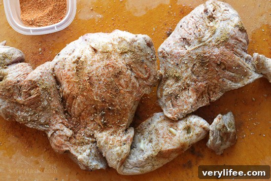 Instant Pot Carnitas: Authentic Mexican Pulled Pork 5 Browned and seasoned pork shoulder on a countertop.