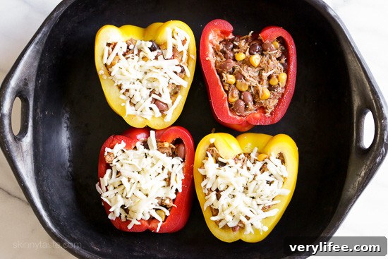 Chicken Taco Chili Stuffed Peppers from Leftovers 2 Stuffed peppers topped with chopped cilantro and avocado