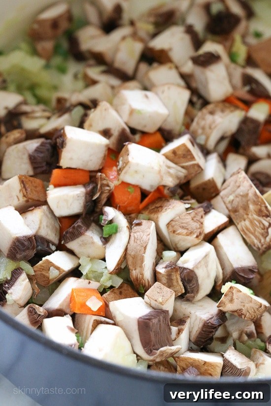 Mushrooms and carrots in a pot