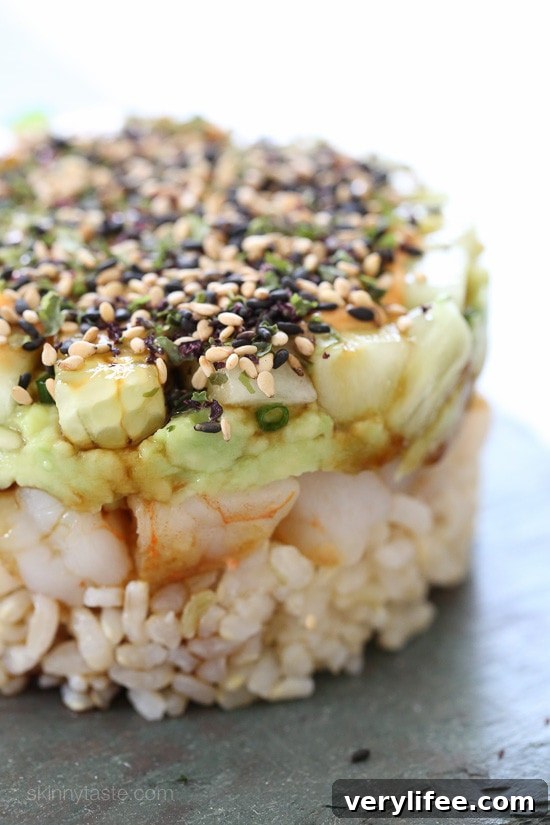 Spicy California Shrimp Stack Side view of Spicy California Shrimp Stack showing layers of rice, shrimp, avocado and cucumber