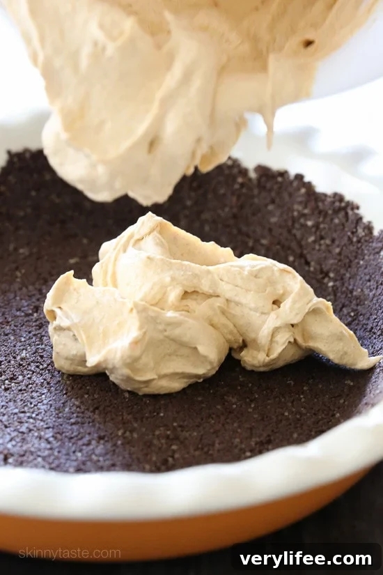 No Bake Pumpkin Cheesecake is an easy, light cheesecake made with pumpkin puree and spices. Under 10 minutes to make, if you use ready-made crust.