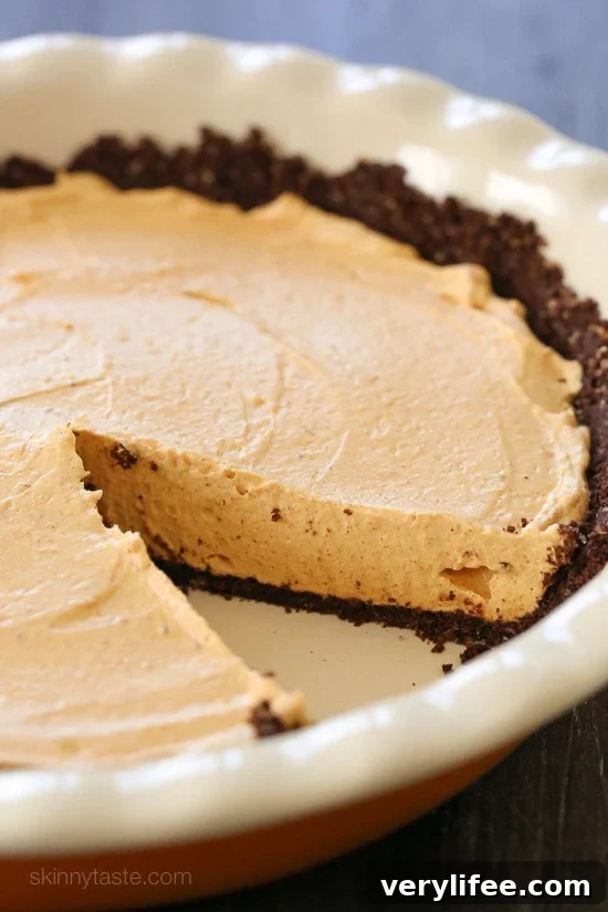 No Bake Pumpkin Cheesecake is an easy, light cheesecake made with pumpkin puree and spices. Under 10 minutes to make, if you use ready-made crust.