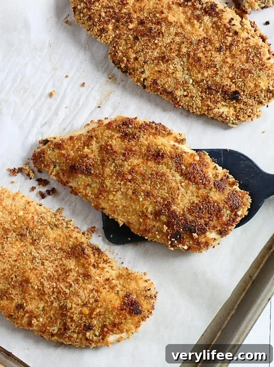Mustard Herb Crusted Chicken Breasts on a tray.