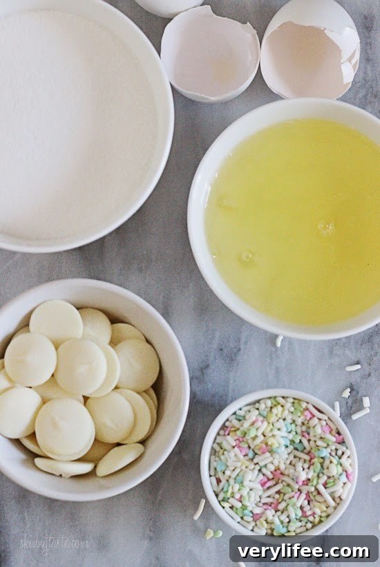 Sprinkle-Dipped Meringue Cookies Recipe 5 Melt-in-your-mouth meringues dipped in creamy white chocolate and sprinkles, is there anything sweeter?