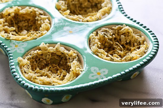 Spaghetti Squash Nests with Baked Eggs Recipe 6 A muffin pan with spaghetti squash in each tin