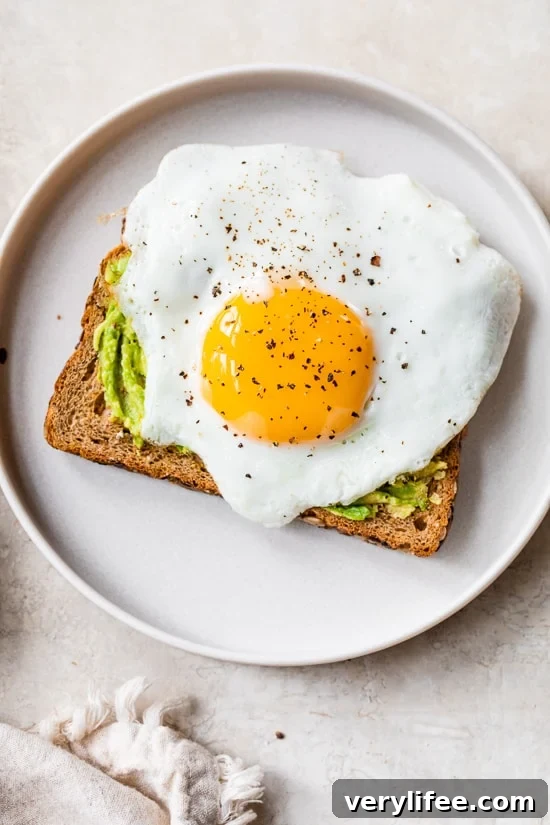 4 Ways to Make Avocado Toast with Egg 7 Avocado Toast with Sunny Side Egg