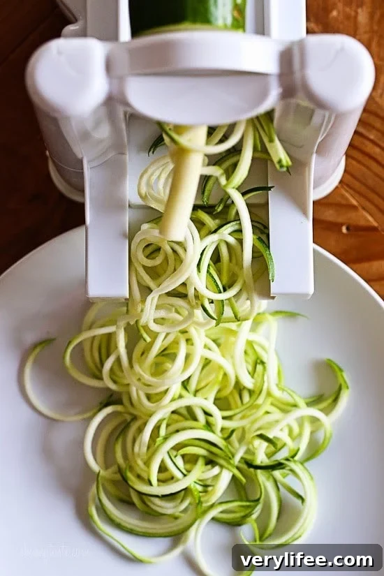 Zucchini noodles and ingredients laid out