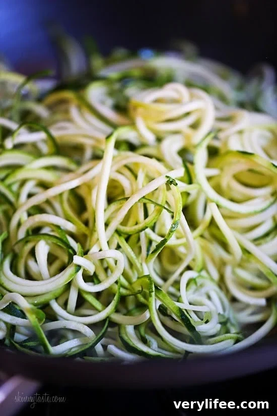 Zucchini Noodle Lo Mein with Chicken for Two 5 Zucchini noodles in a wok