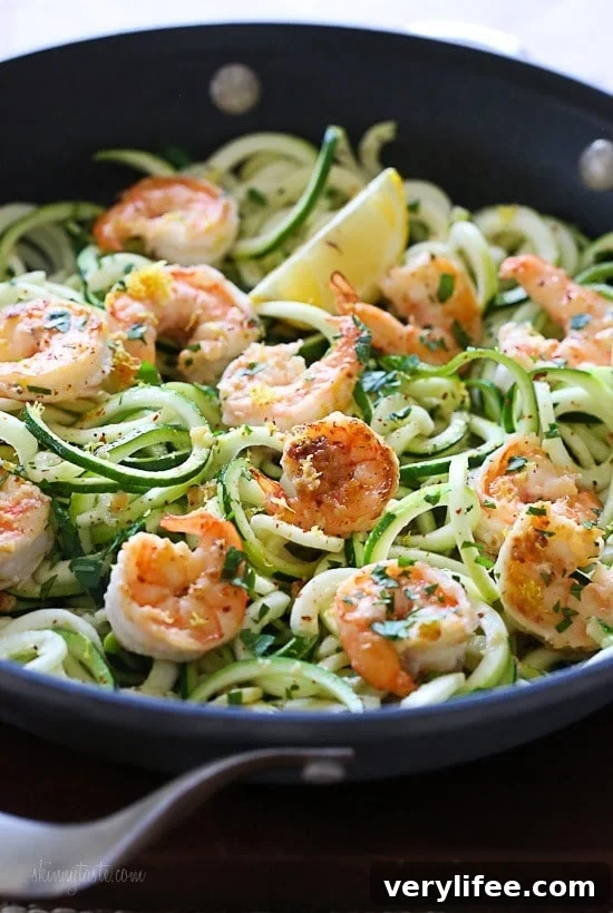 Shrimp Scampi Zoodles for Two, a delicious garlic shrimp and lemon dish over zucchini noodles is an EASY low-carb dish that takes less than 20 minutes! It's also gluten-free, paleo, Whole30 and keto!