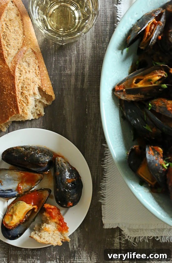 Mussels in a spicy red marinara sauce – simple and elegant, best served with lots of whole wheat crusty bread for dipping into the delicious sauce.