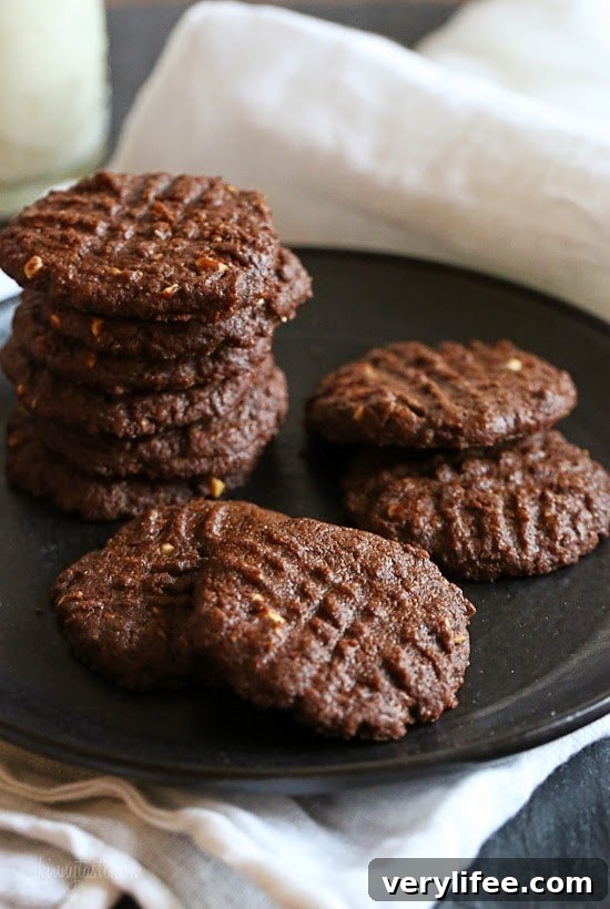 These cookies are amazing!!! And so easy to make,  you don't even need a mixer! Only 5 ingredients including Nutella, Chunky Almond Butter and Cocoa Powder.