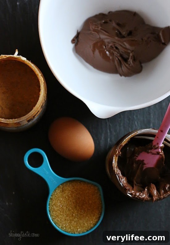 These cookies are amazing!!! And so easy to make,  you don't even need a mixer! Only 5 ingredients including Nutella, Chunky Almond Butter and Cocoa Powder.