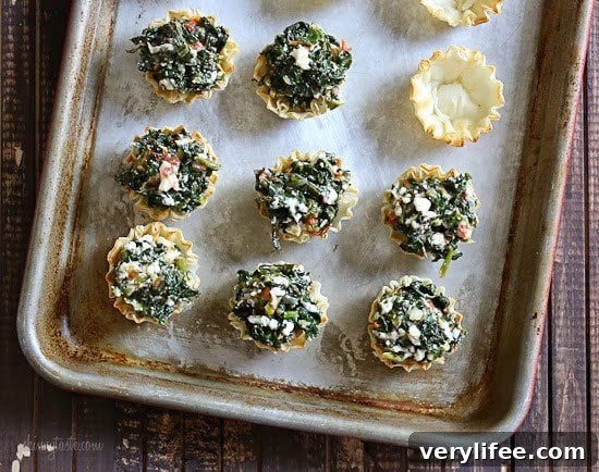Tray of mini Greek spinach pies ready to serve