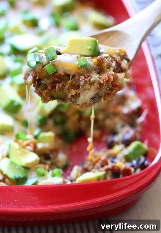 Quinoa Fiesta Enchilada Bake made with quinoa, black beans, corn, cilantro and green chiles topped with a quick homemade enchilada sauce and cheesy goodness!