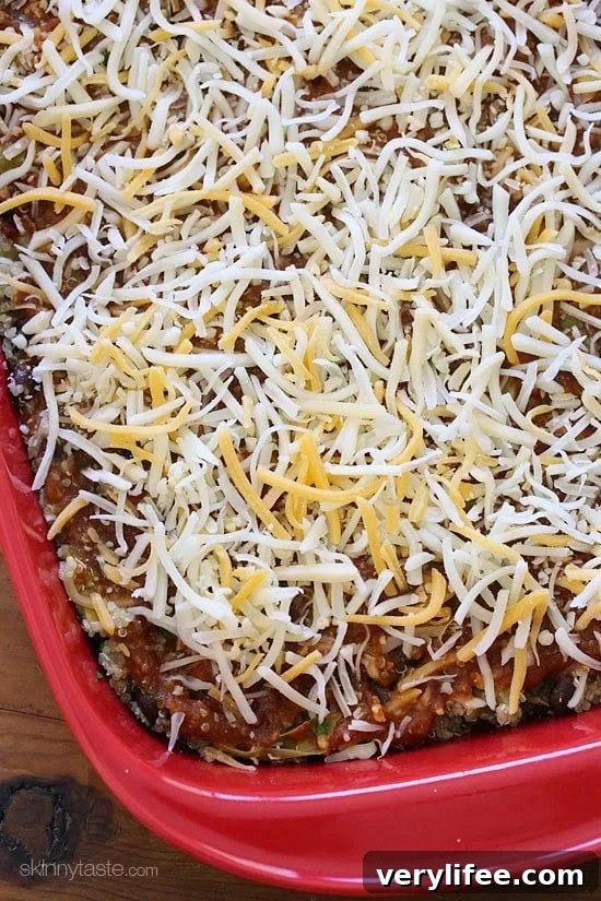 Quinoa Fiesta Enchilada Bake made with quinoa, black beans, corn, cilantro and green chiles topped with a quick homemade enchilada sauce and cheesy goodness!