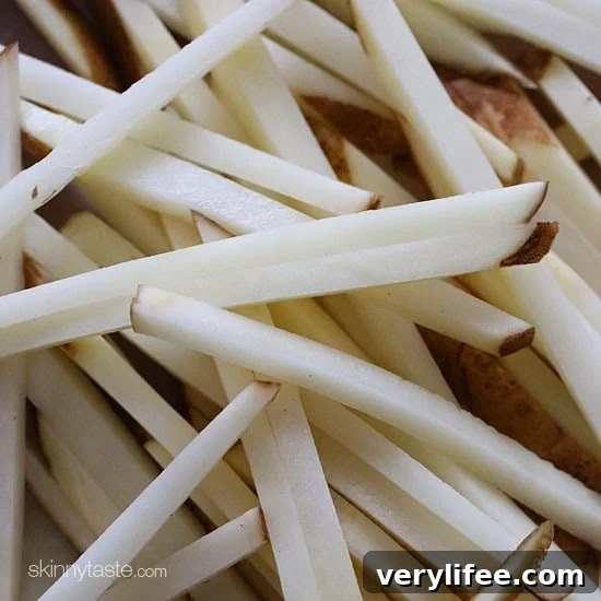 These delicious fries are baked in the oven with garlic, a little olive oil, kosher salt and black pepper, then sprinkled with freshly grated Parmesan and parsley – to die for!