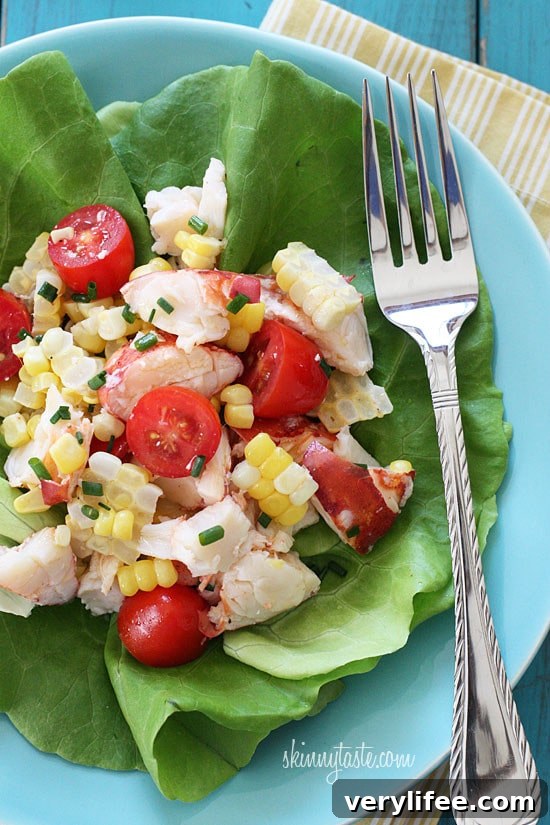 Chilled Lobster Salad with Sweet Summer Corn and Tomatoes, the perfect light summer salad made with sweet summer corn, grape tomatoes, garden herbs and chilled steamed lobster.
