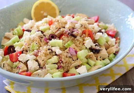 Chicken and quinoa salad made with cucumbers, feta, tomatoes and olives is perfect for summer!