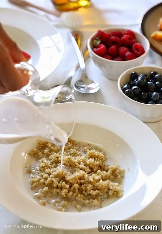 Warm quinoa cereal with fresh fruit and honey