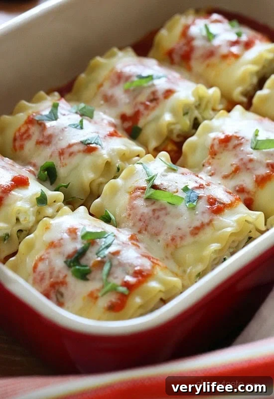 Zucchini Lasagna Roll-Ups Recipe 3 Lasagna rolls arranged in a baking dish before baking