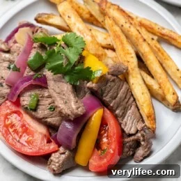 Peruvian Lomo Saltado: Authentic Stir-Fried Beef and Fries 12 Lomo saltado on plate
