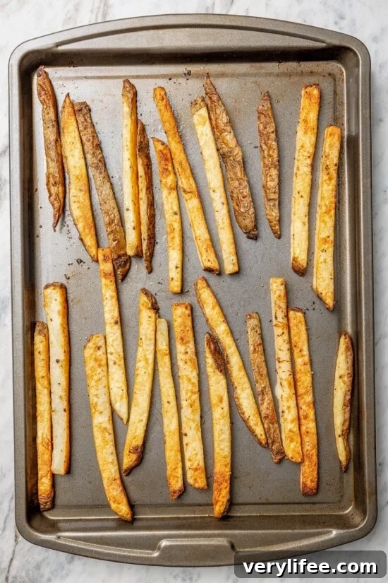 Peruvian Lomo Saltado: Authentic Stir-Fried Beef and Fries 7 Overhead view of baked fries on sheet pan