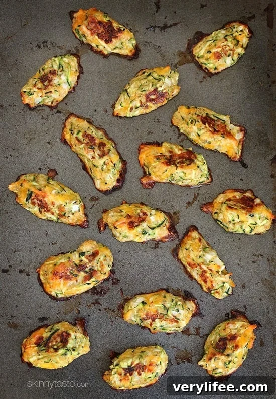 Zucchini Tots are a great way to get your family to eat their veggies! These kid-friendly zucchini tots, made with shredded zucchini and cheese make a great side dish or snack.
