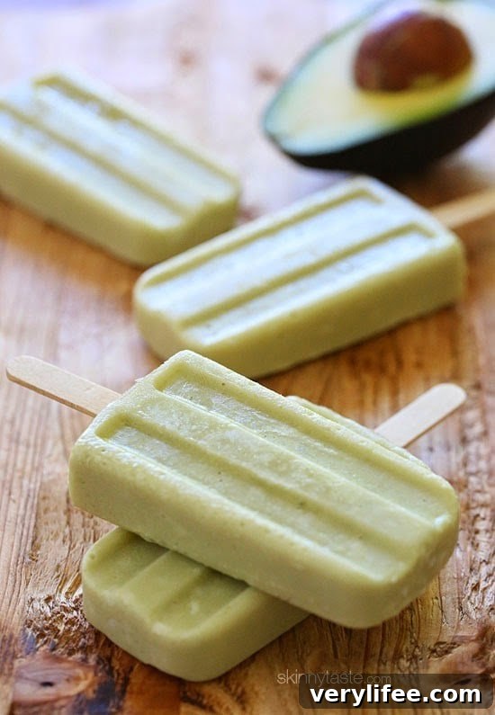 These creamy avocado coconut popsicles are made with just 4 ingredients – nutrient dense avocados, coconut-almond milk, raw sugar and coconut flakes.