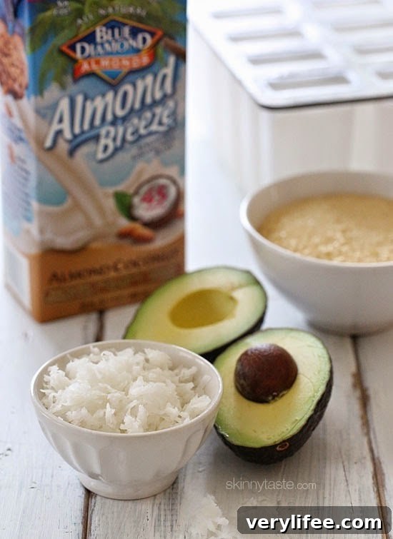 These creamy avocado coconut popsicles are made with just 4 ingredients – nutrient dense avocados, coconut-almond milk, raw sugar and coconut flakes.