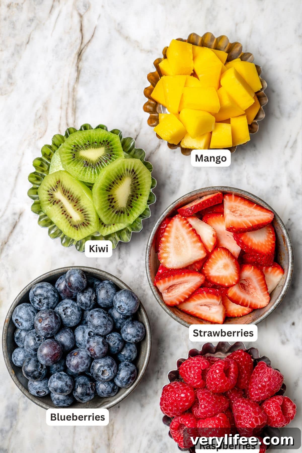Overhead view of fruit for fruit pizza