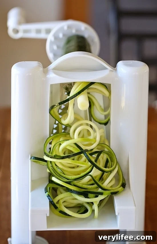 Spicy shrimp with garlic, zucchini noodles (zoodles), tomatoes and a squeeze of lemon