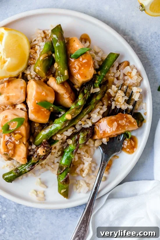 This quick weeknight Chicken and Asparagus Lemon Stir Fry is perfect for spring, made with lean chicken breast, asparagus, fresh lemon, garlic and ginger.