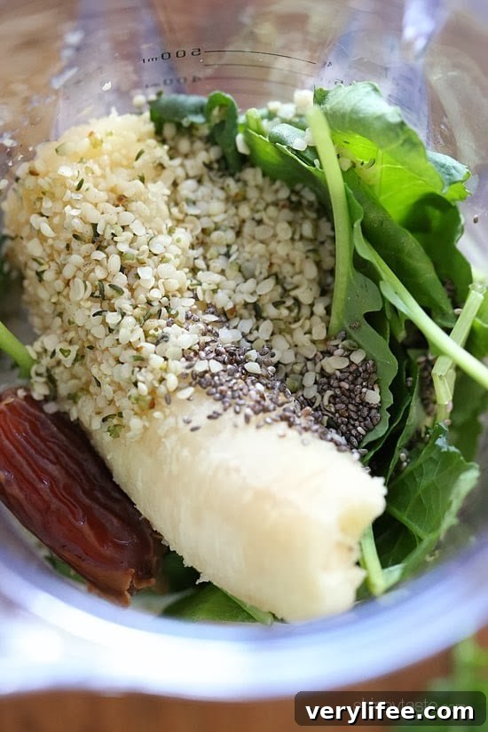 Kale and Banana Superfood Smoothie with Chia and Hemp 3 Kale, Banana, Chia, Hemp Superfood Smoothie in a glass with seeds